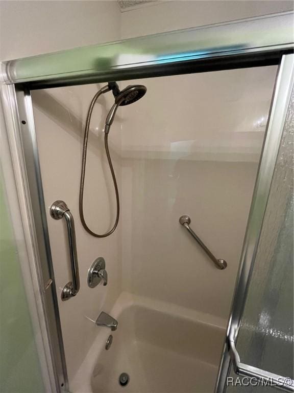 717 Whispering Pines Blvd, Inverness, FL 34453 - bathroom with combined bath / shower with glass door