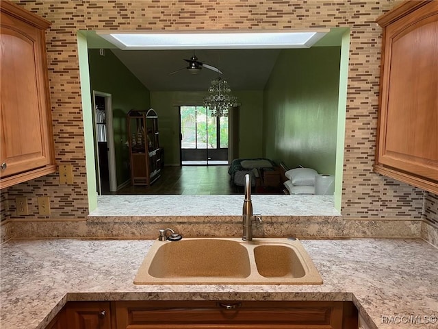717 Whispering Pines Blvd, Inverness, FL 34453 - kitchen with lofted ceiling, ceiling fan, and light countertops