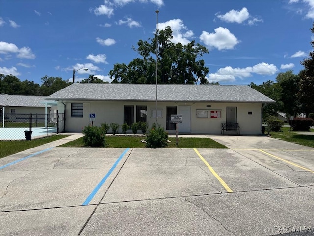 717 Whispering Pines Blvd, Inverness, FL 34453 - view of front facade with uncovered parking and stucco siding