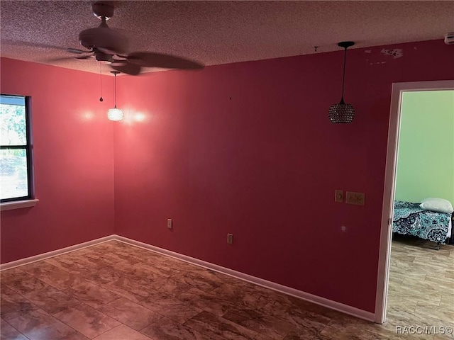 717 Whispering Pines Blvd, Inverness, FL 34453 - spare room with a textured ceiling and ceiling fan