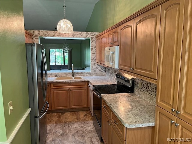 717 Whispering Pines Blvd, Inverness, FL 34453 - kitchen featuring electric range oven, freestanding refrigerator, white microwave, backsplash, and vaulted ceiling
