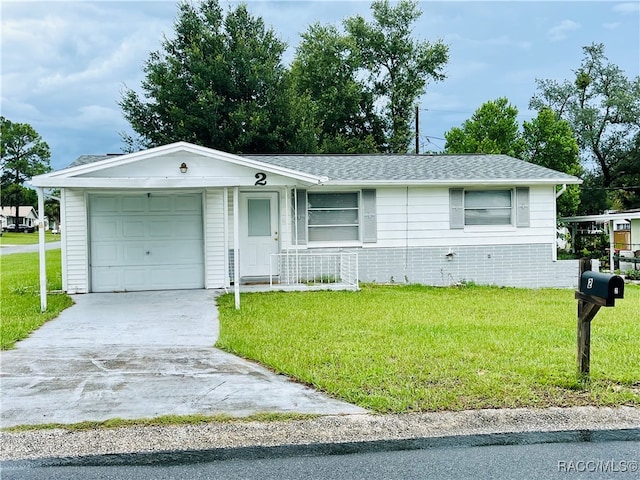 single story home with a front yard and a garage