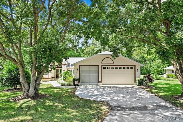 view of front facade with a front yard and a garage