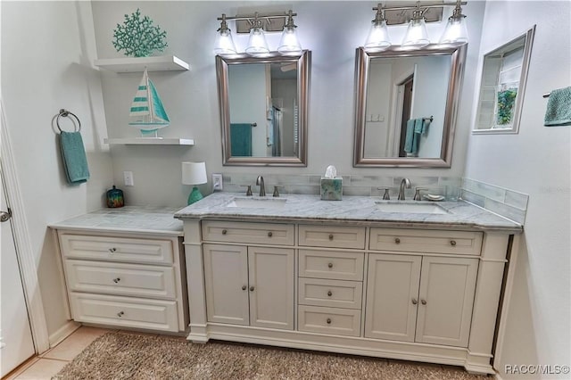 bathroom with tile patterned floors and vanity