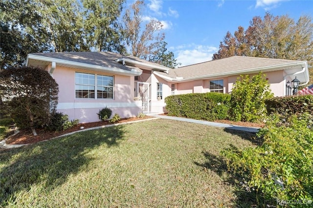 single story home with a front lawn