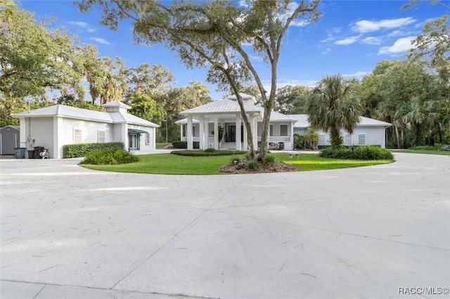 greek revival house featuring a front lawn