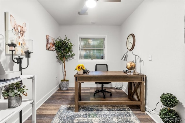 home office featuring wood finished floors, a ceiling fan, and baseboards