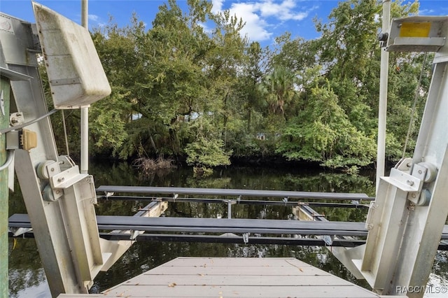 view of dock with a water view and boat lift