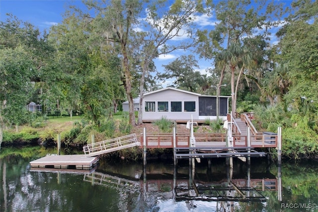 dock area with a water view and stairs