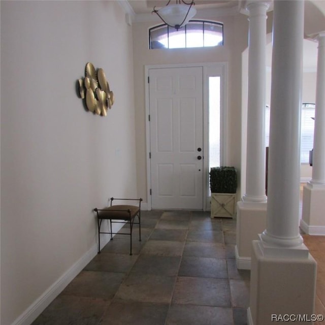 foyer entrance featuring ornate columns