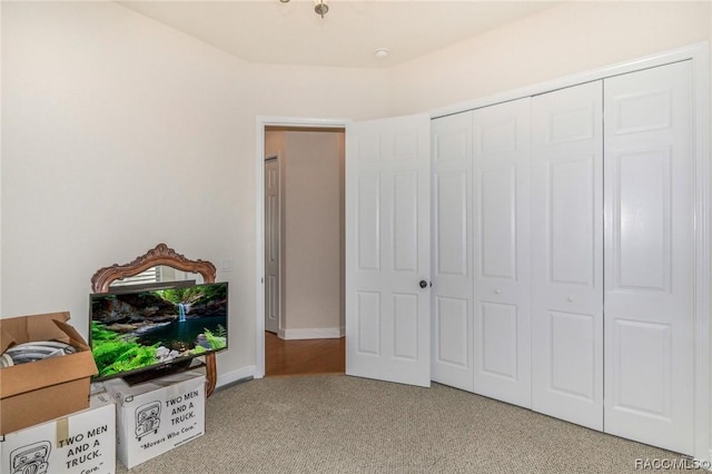 carpeted bedroom with a closet