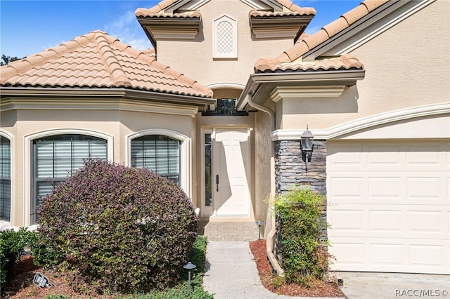 entrance to property featuring a garage