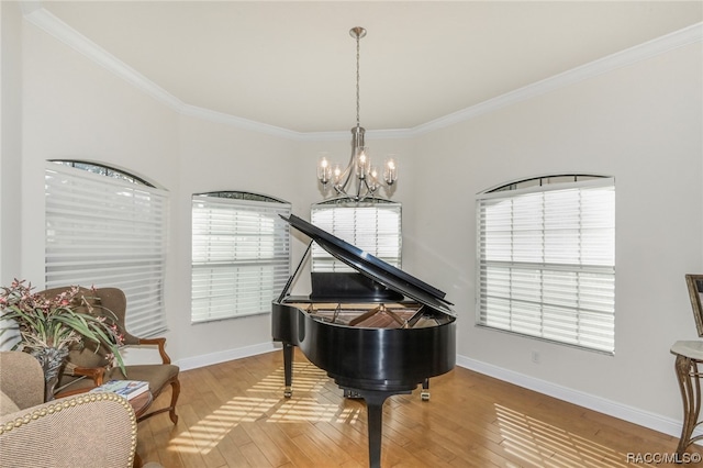 interior space featuring crown molding, wood-type flooring, and a chandelier