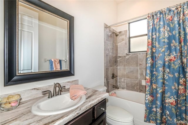 full bathroom with shower / bathtub combination with curtain, vanity, and toilet