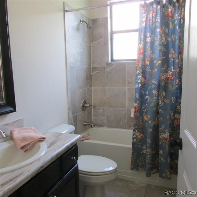 full bathroom featuring tile patterned flooring, shower / bath combo, vanity, and toilet