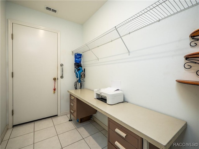 laundry room with light tile patterned floors