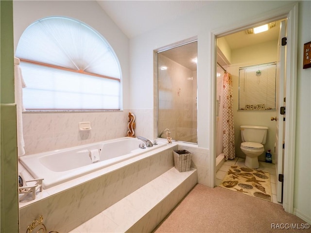 bathroom featuring toilet and plus walk in shower