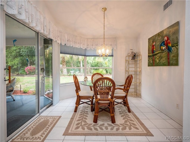 tiled dining space with a notable chandelier