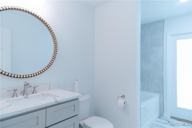 97 W Camino Ln, Citrus Springs, FL 34434 - bathroom with vanity, a washtub, and toilet