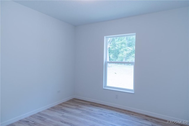 97 W Camino Ln, Citrus Springs, FL 34434 - empty room with baseboards and light wood-type flooring