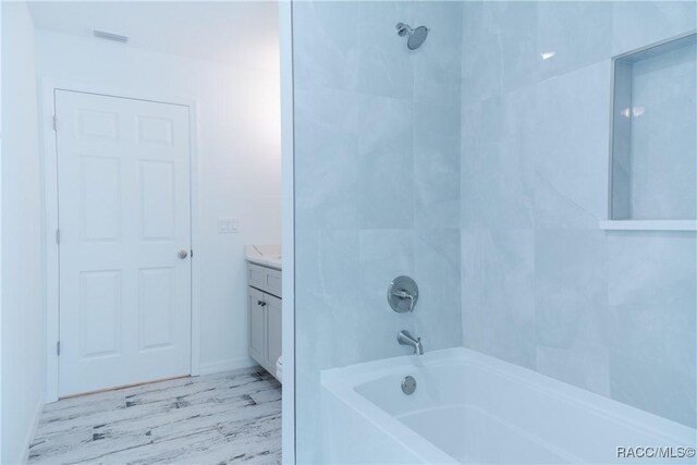 97 W Camino Ln, Citrus Springs, FL 34434 - full bath featuring vanity,  shower combination, and wood finished floors