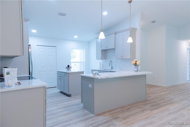97 W Camino Ln, Citrus Springs, FL 34434 - kitchen featuring a sink, a center island, light wood finished floors, and visible vents