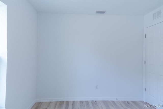 97 W Camino Ln, Citrus Springs, FL 34434 - unfurnished room featuring baseboards, light wood-style flooring, and visible vents