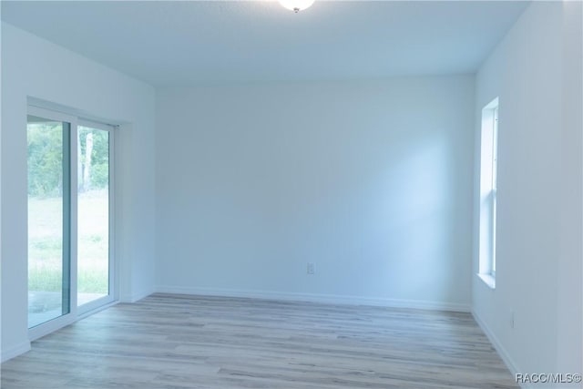 97 W Camino Ln, Citrus Springs, FL 34434 - unfurnished room featuring baseboards and light wood-style flooring