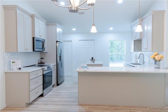 97 W Camino Ln, Citrus Springs, FL 34434 - kitchen featuring a sink, light wood-style floors, light countertops, stainless steel appliances, and decorative backsplash