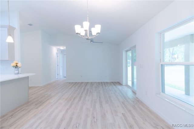 97 W Camino Ln, Citrus Springs, FL 34434 - interior space with light wood-style floors, baseboards, and a notable chandelier