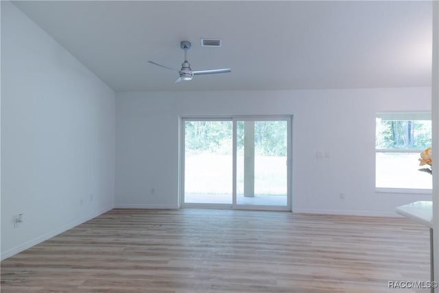 97 W Camino Ln, Citrus Springs, FL 34434 - spare room featuring visible vents, a ceiling fan, baseboards, and light wood-type flooring