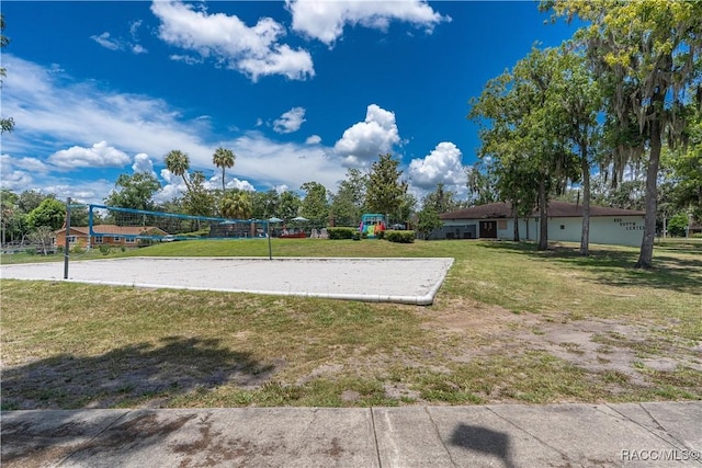 688 Midway Dr Unit B, Ocala, FL 34472 - view of community featuring volleyball court and a yard