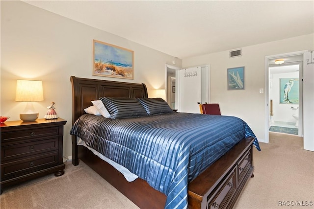 688 Midway Dr Unit B, Ocala, FL 34472 - bedroom featuring light carpet and ensuite bathroom