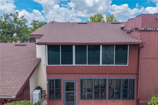 688 Midway Dr Unit B, Ocala, FL 34472 - back of property featuring a shingled roof