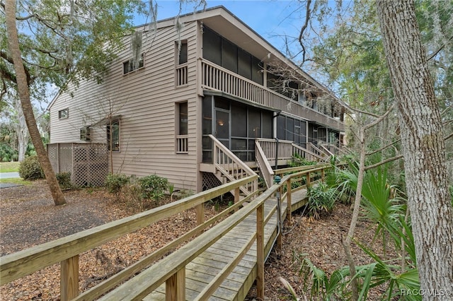 5155 S Gray Pelican Way, Homosassa, FL 34448 - rear view of property with a sunroom and stairs