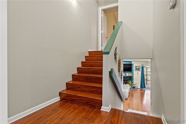 5155 S Gray Pelican Way, Homosassa, FL 34448 - staircase with wood finished floors and baseboards