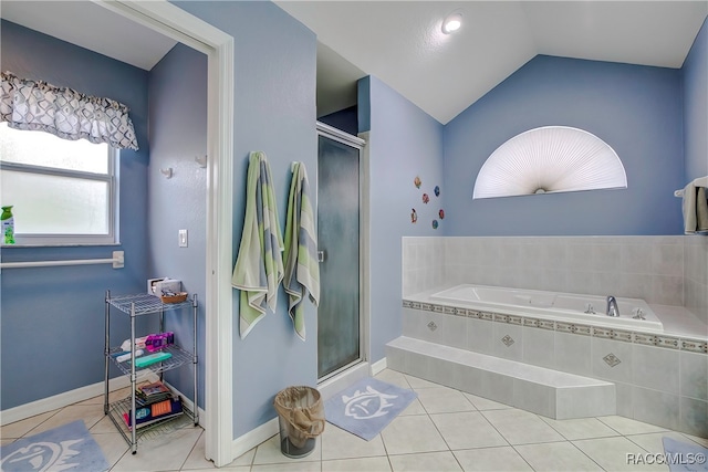 bathroom with tile patterned floors, lofted ceiling, and shower with separate bathtub