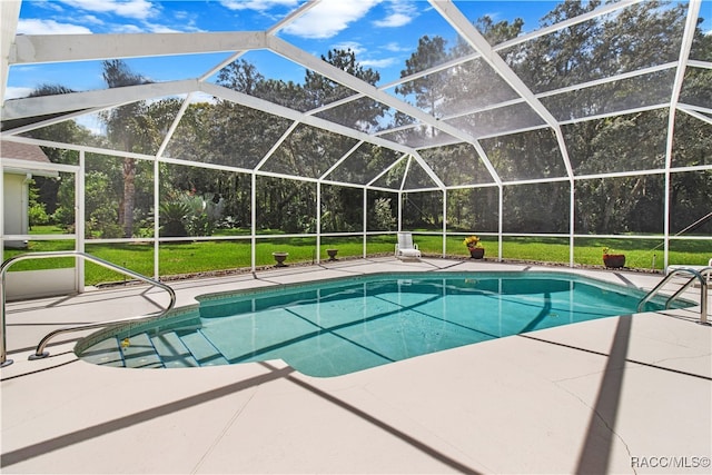 view of pool with a lanai and a patio area