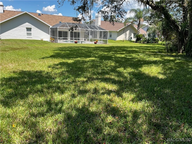 view of yard featuring a lanai