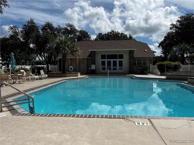 view of pool featuring a patio