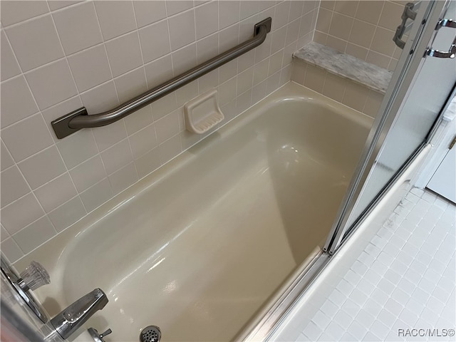 bathroom with tile patterned flooring and independent shower and bath