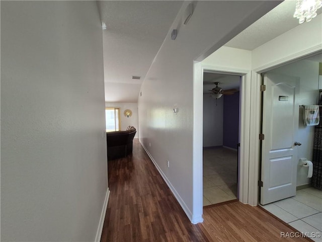 hallway with wood-type flooring