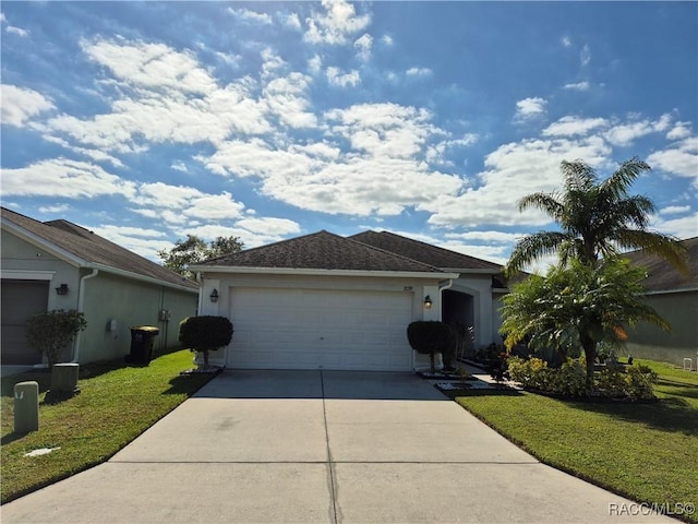 single story home featuring a garage and a front lawn