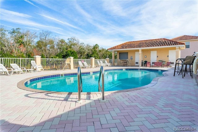 view of swimming pool featuring a patio