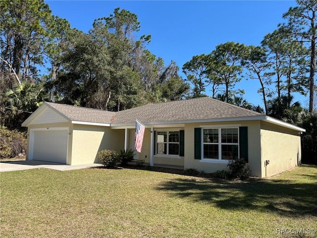 single story home featuring a garage, driveway, a front yard, and stucco siding