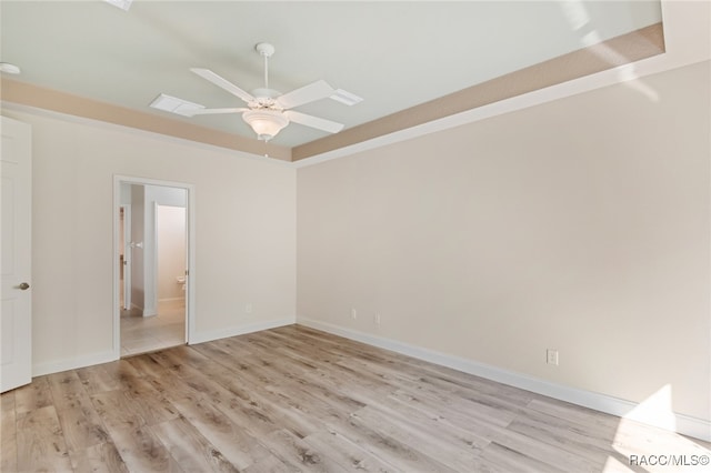 spare room featuring ceiling fan and light hardwood / wood-style flooring