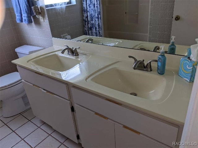 bathroom featuring toilet, tile walls, vanity, a shower with shower curtain, and tile patterned flooring