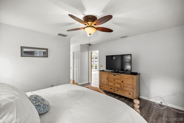 bedroom featuring ceiling fan and dark hardwood / wood-style floors