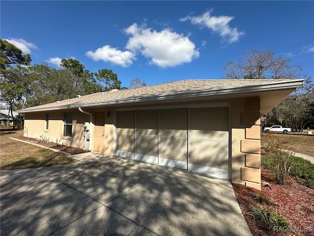 view of property exterior with a garage