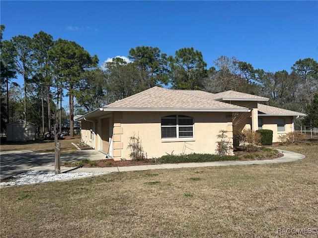 view of side of home with a yard and a garage